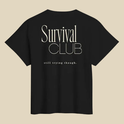 Black t-shirt with 'Survival Club' text on the back against a white background
